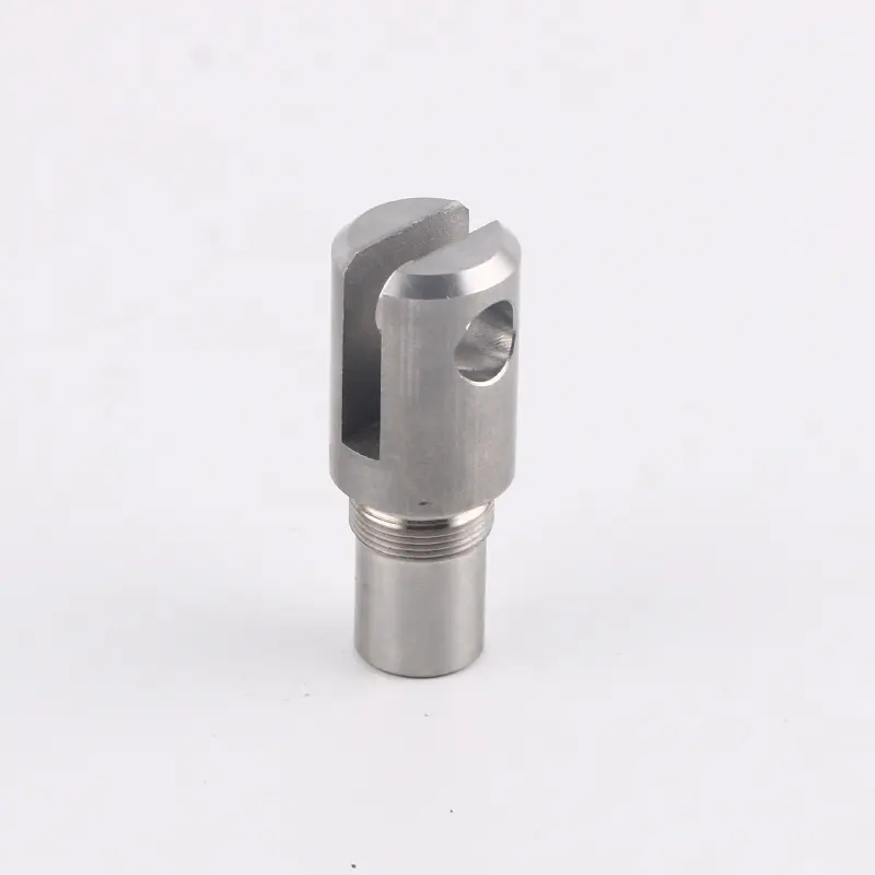 Custom CNC machined stainless steel part with a slotted design and threaded base for precise industrial applications