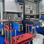 Hydraulic rubber compression molding press machine in factory workshop, silicone and rubber parts manufacturing equipment