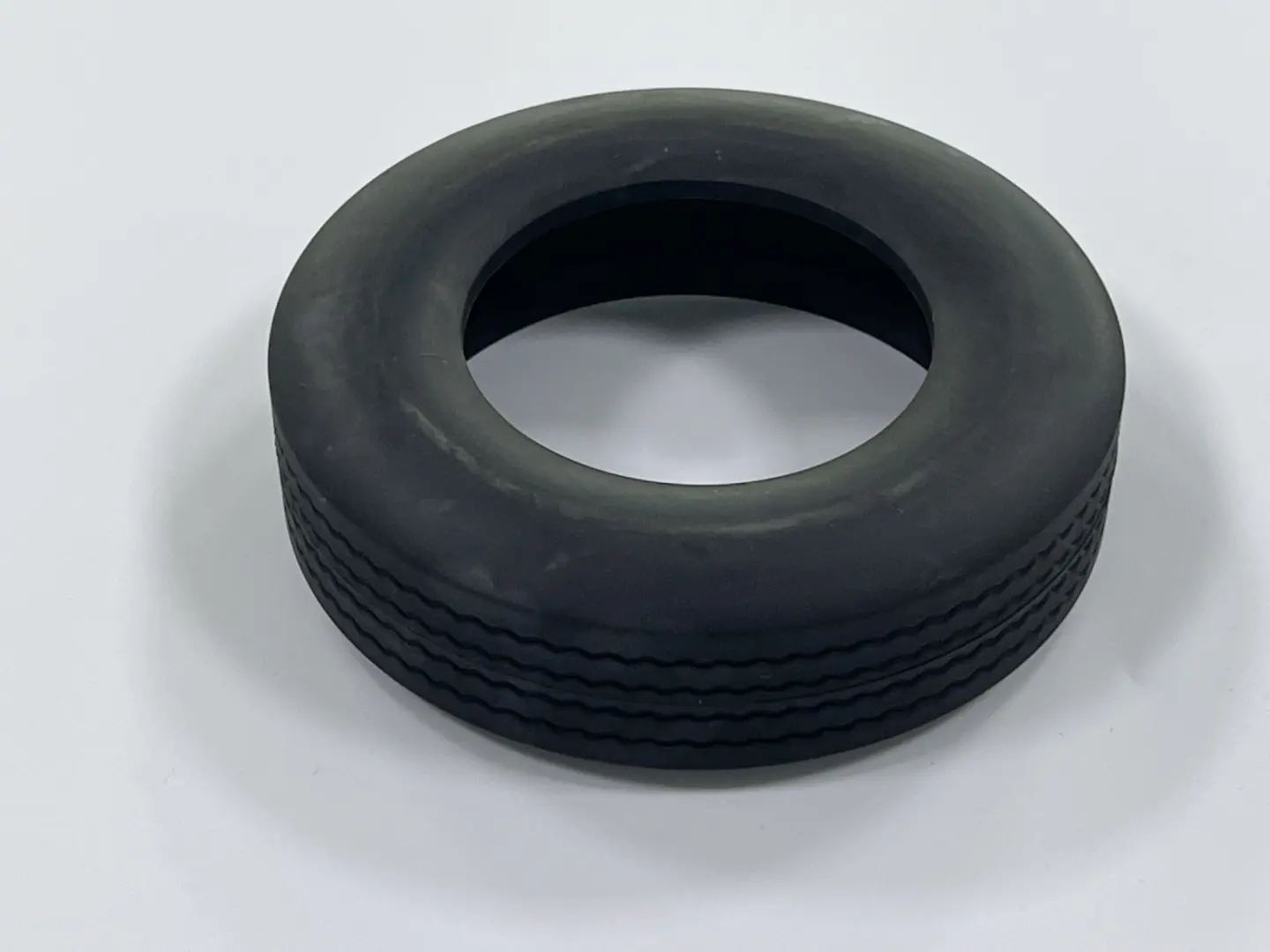 Custom molded solid rubber drive wheel tire with wavy tread, heavy-duty industrial rubber roller wheel
