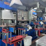 Automatic vacuum rubber compression molding press machine in factory workshop, silicone and rubber parts manufacturing equipment