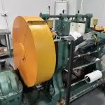 Silicone rubber mixing mill in factory workshop, two-roll rubber mixing machine for raw material preparation