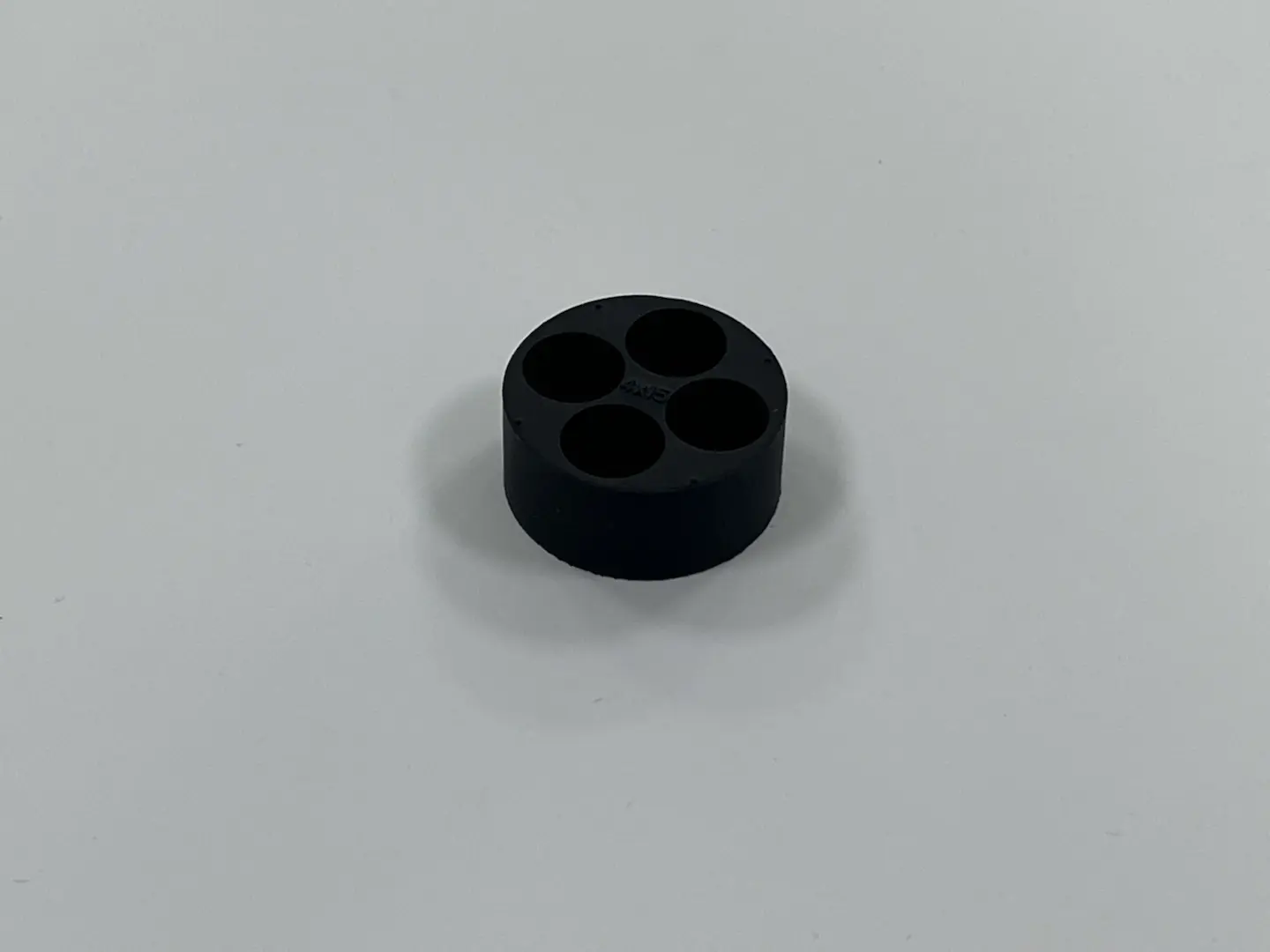 Custom molded black rubber cable gland with 4 holes, industrial multi-cable sealing rubber plug