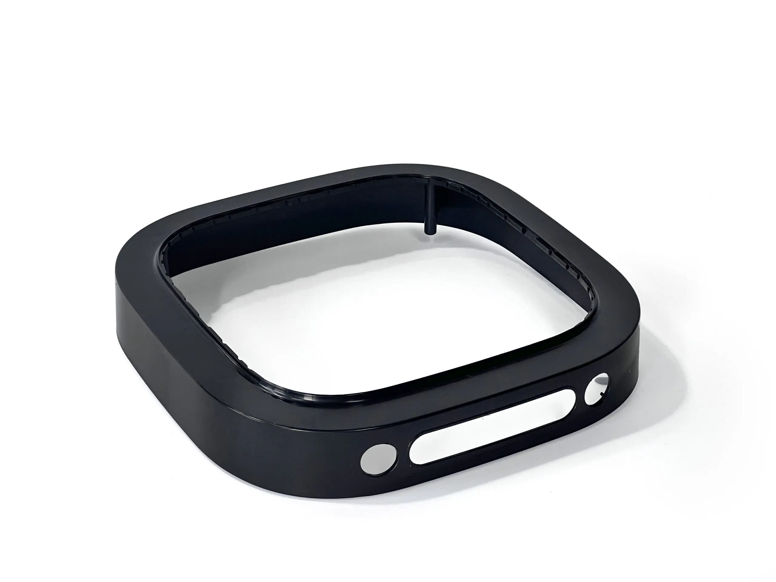 Custom black plastic injection molded part, designed for high-precision electronic enclosures with smooth edges and multiple openings for assembly and functionality.