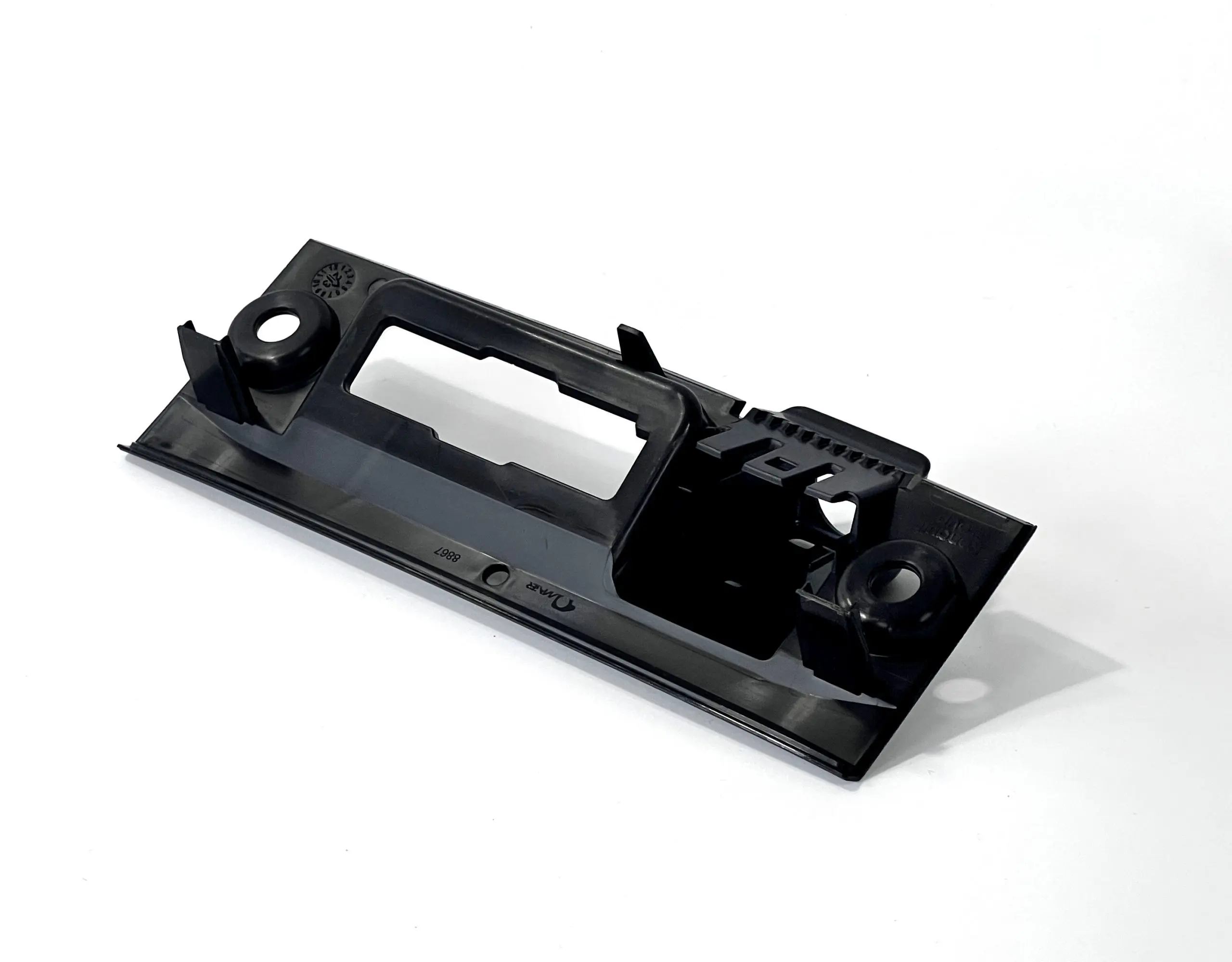 Black plastic housing part with precise cut-outs and mounting features, ideal for electronics enclosures and mechanical assemblies.