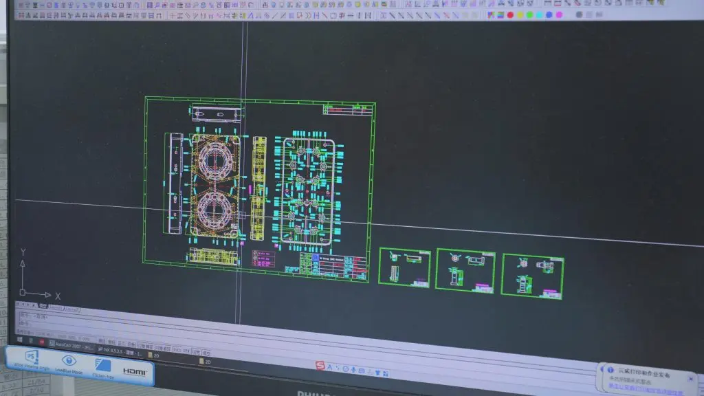 2D CAD drawing of custom injection mold components, precision mold design with detailed engineering specifications