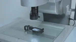 Vision Measuring Machine (VMM) inspecting a precision plastic injection molded part, 2D dimensional quality control check