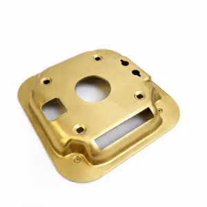 Brass CNC machined plate with precision cutouts and holes, used for mechanical applications requiring high durability and custom design.
