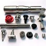 High-precision CNC machined metal components for industrial use, including gears, nozzles, and fittings in various materials like aluminum and steel.